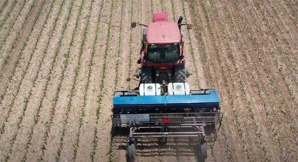 Aerial of planter in farm field