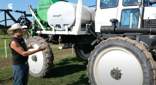 Man pointing to farm equipment
