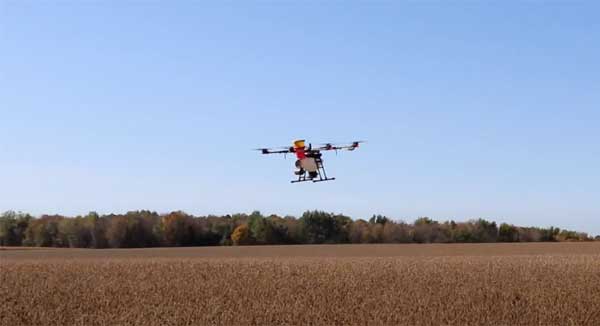 Drone flying above farm field