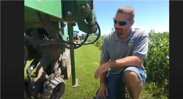 Man looking at farm equipment