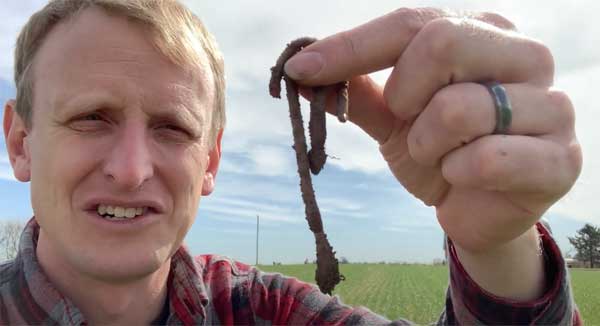 Man holding earthworm