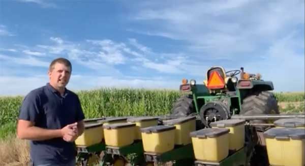 Farmer standing in front of planter