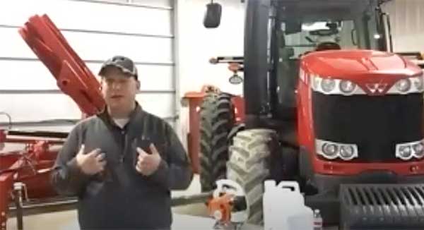 Man standing in front of red planter