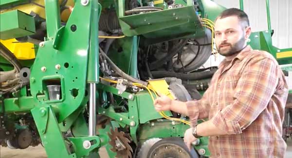 Man standing in front of planter