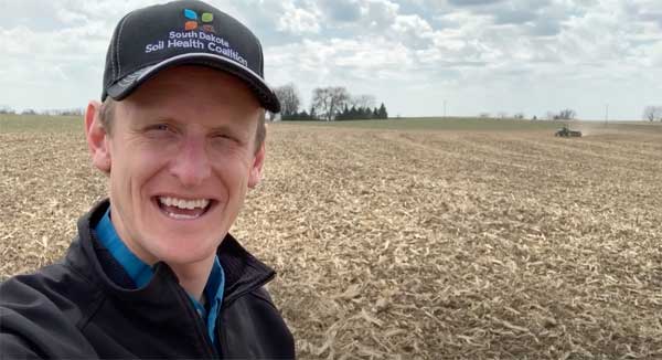 Man talking in farm field