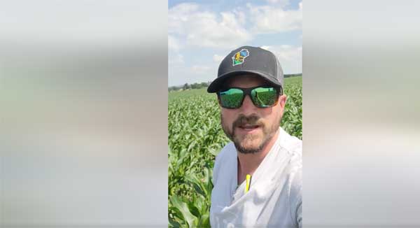 Man standing in farm field