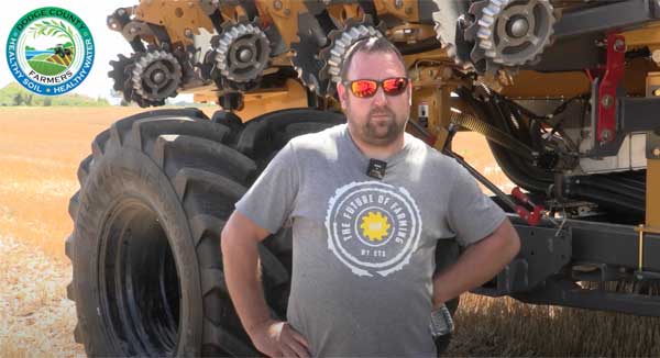 Farmer standing in front of planter