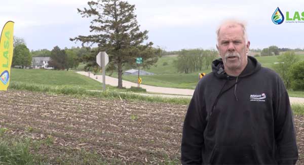Farmer talking to camera in farm field