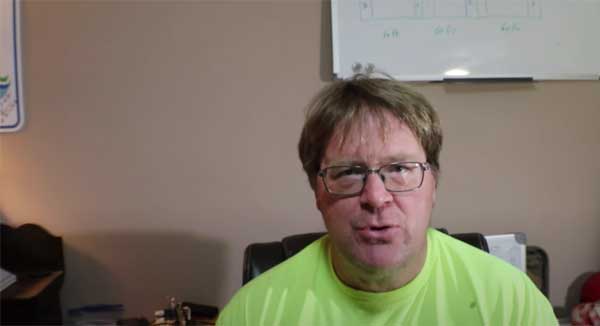 Man talking to camera in home office