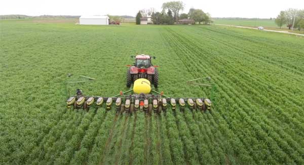 Aerial view of interseeder planting in farm field