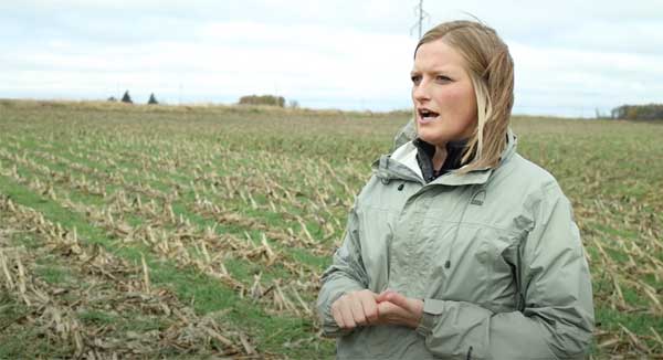 Farmer talking to camera in a farm field
