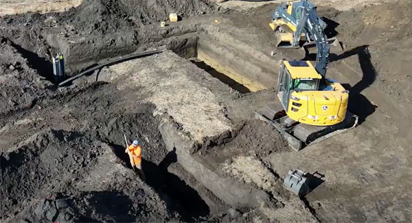 workers installing a bioreactor