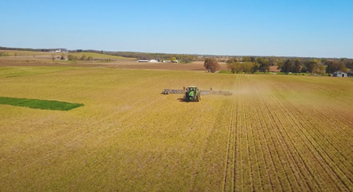 Planter planting cover crops in a farm field